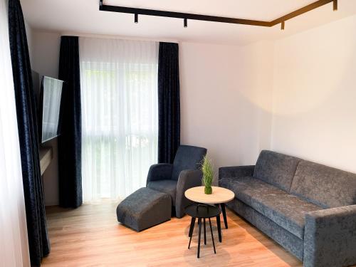 Ruang duduk di HOLI City Apart Hotel Berlin