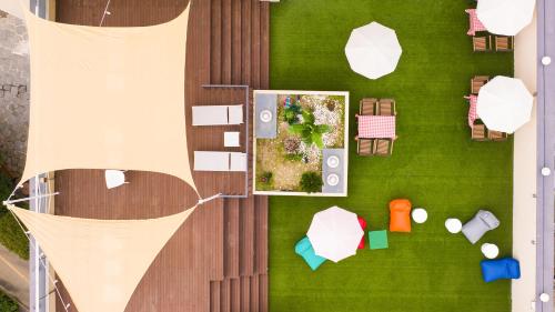 an overhead view of a backyard with a garden at Geoje Mongdol Beach H Avenue Hotel in Geoje 