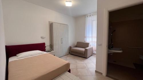 Ένα ή περισσότερα κρεβάτια σε δωμάτιο στο B&B Aurora