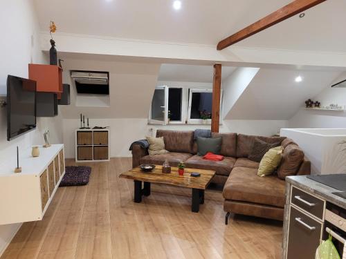 a living room with a couch and a table at Casa-Mandelartz in Rees