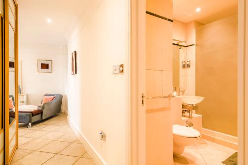 a bathroom with a toilet and a sink at London Bridge Penthouse - Luxury in London