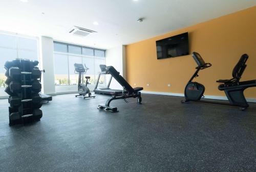 a gym with several exercise bikes in a room at Wyndham Garden El Morro Montecristi in El Rincón
