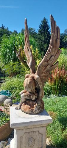 a statue of an eagle sitting on top of a monument at Ferienhaus Erika in Voitsberg