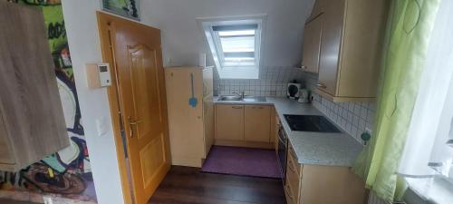 a small kitchen with a sink and a window at Ferienhaus Erika in Voitsberg