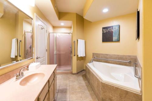 a bathroom with a tub and a sink at Hilton Vacation Club Scottsdale Villa Mirage in Scottsdale