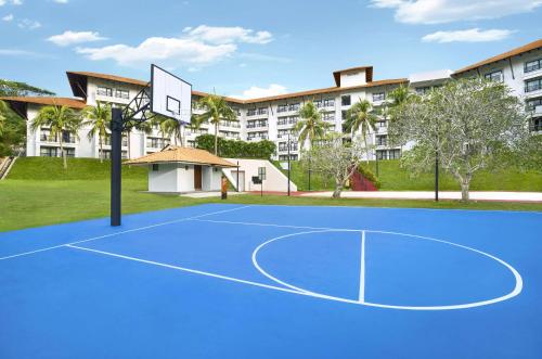 a basketball court in front of a building at DoubleTree by Hilton Damai Laut in Lumut
