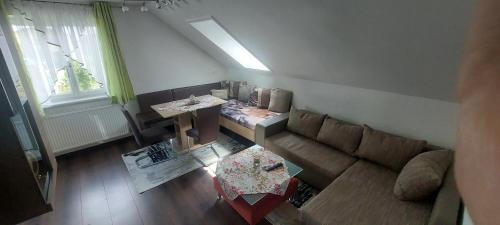 a living room with a couch and a table at Ferienhaus Erika in Voitsberg
