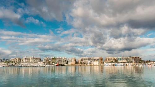 a view of a city from the water at Ático puerto Burriana in Burriana