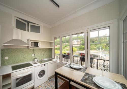 a kitchen with a sink and a dishwasher at Apartamento con garaje en el centro de Zumaia in Zumaia