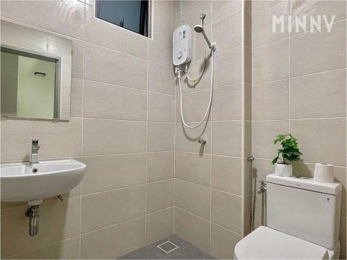 a bathroom with a shower and a toilet and a sink at Parkland Batu 11 near MRT 5-6PAX Free Parking in Cheras
