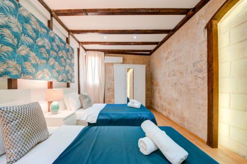 Postelja oz. postelje v sobi nastanitve Valletta Waterfront Villa with Pool and Jacuzzi