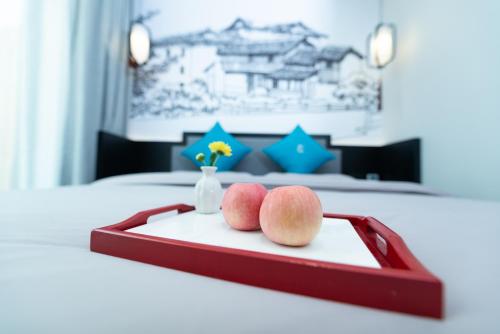 Postel nebo postele na pokoji v ubytování Gongxili - Pujian Hotel