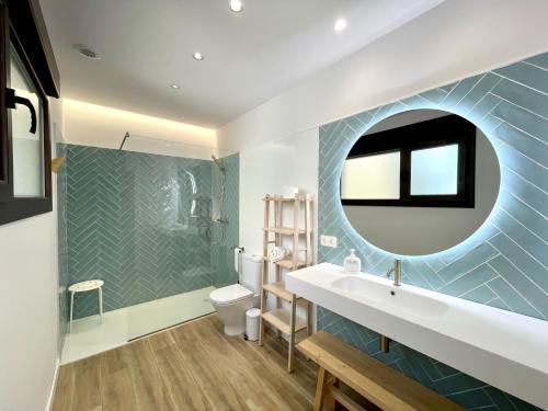 a bathroom with a sink and a mirror at El Ciprés de Valdeprados in Valdeprados