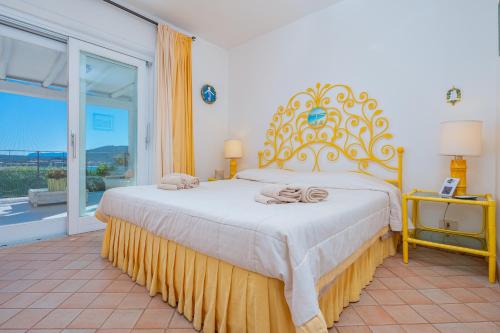 Ένα ή περισσότερα κρεβάτια σε δωμάτιο στο Bella Vista Marinella 1