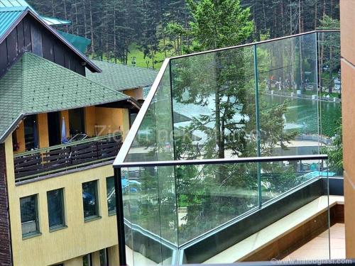 arial view of a building with a glass facade at King's Square Lux apartment Zlatibor 1 in Zlatibor