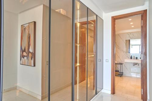 a glass elevator in a room with a hallway at Apartment Sea View B14 - Mosquée Hassan II - By TheCasaEdition in Casablanca