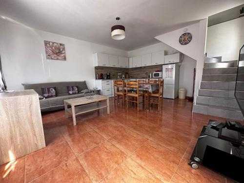 a living room with a couch and a table at Casa do Castelo in Valhelhas