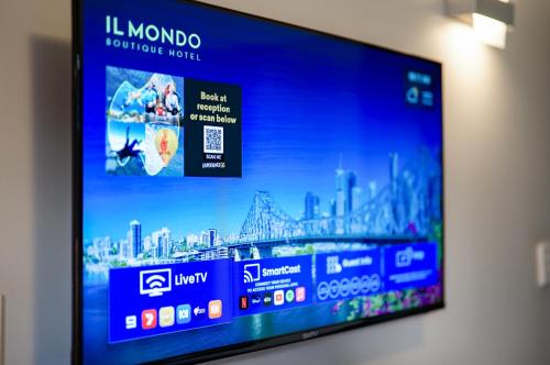 a flat screen tv hanging on a wall at Il Mondo Boutique Hotel in Brisbane
