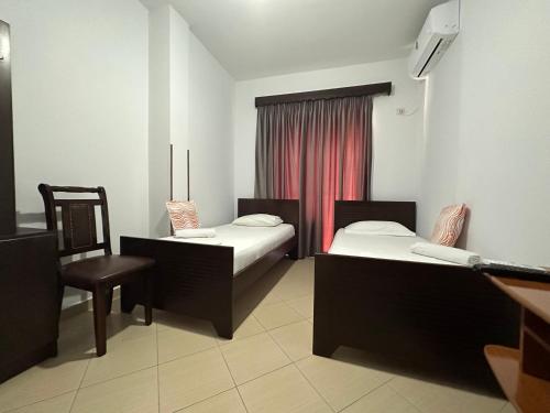 Ένα ή περισσότερα κρεβάτια σε δωμάτιο στο Hotel Trifoni