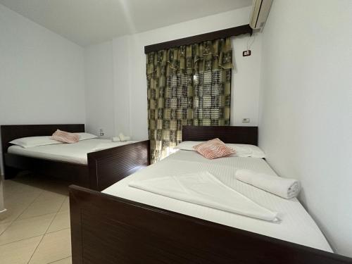 Ένα ή περισσότερα κρεβάτια σε δωμάτιο στο Hotel Trifoni