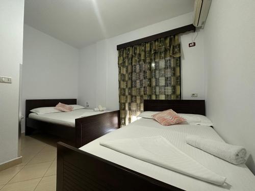 Ένα ή περισσότερα κρεβάτια σε δωμάτιο στο Hotel Trifoni
