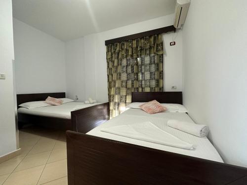 Ένα ή περισσότερα κρεβάτια σε δωμάτιο στο Hotel Trifoni
