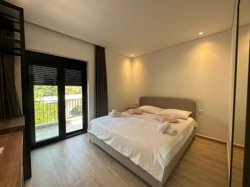 Ένα ή περισσότερα κρεβάτια σε δωμάτιο στο Hotel Trifoni