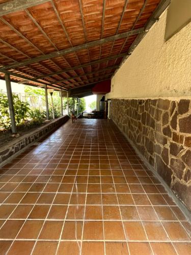 an empty hallway of a building with a wooden ceiling at Casa Morello in Zambrone
