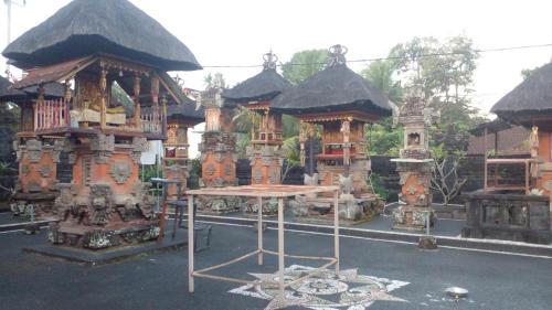 a building with a table in front of it at Umah Desa in Banjarangkan