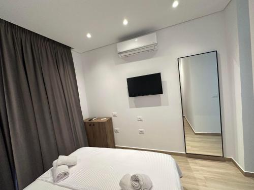 Ένα ή περισσότερα κρεβάτια σε δωμάτιο στο Hotel Trifoni