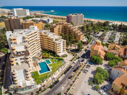 an aerial view of a city with buildings and the ocean at Vilamoura Bay Retreat @ Marina Mar in Quarteira