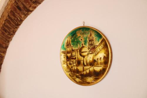 a round orb with a painting of a city at Casa da Moeda in Évora