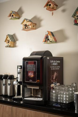a coffee machine sitting on top of a counter at Hotel Kindermann in Caçador