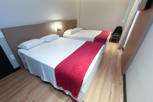 Postel nebo postele na pokoji v ubytování Arco do Sol Park Hotel