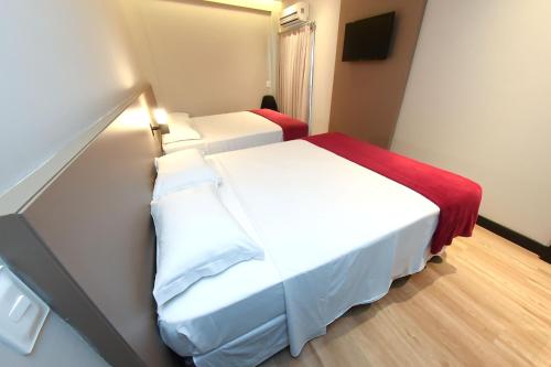 Postel nebo postele na pokoji v ubytování Arco do Sol Park Hotel