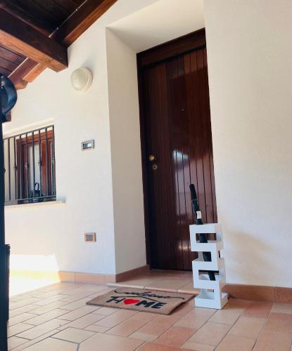 a door of a house with a ladder next to it at StaraGo Attic Suite - Elegante mansarda in centro storico in Gorizia