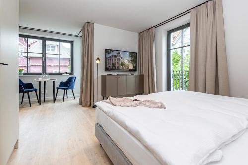 Ένα ή περισσότερα κρεβάτια σε δωμάτιο στο Gustav Appartements