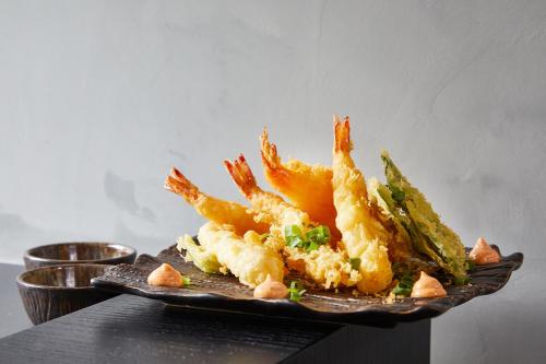 a plate of food with shrimp on a table at Ultra Marine by Zdrojowa in Kołobrzeg