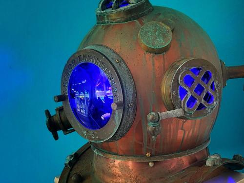 an old rusty fire hydrant with a blue window at Sea Bean 2 Bedroom House Manorbier Tenby Pet Friendly in Manorbier