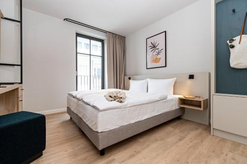 Ένα ή περισσότερα κρεβάτια σε δωμάτιο στο Gustav Appartements