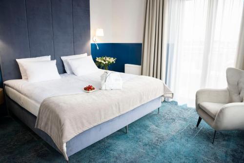Ένα ή περισσότερα κρεβάτια σε δωμάτιο στο Hotel Szafir
