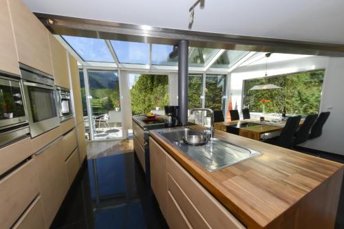 a kitchen with a counter with a sink in it at AlpinDesign Kaunertal in Kaunertal