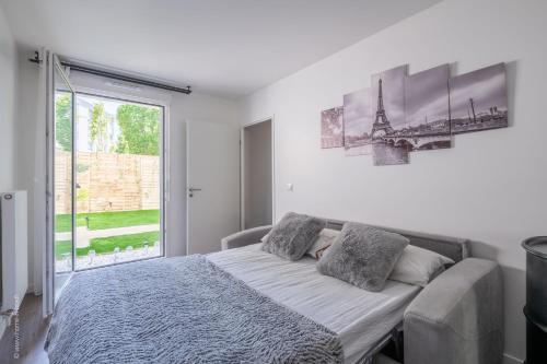 Giường trong phòng chung tại Confort Familial/Professionnel aux Portes de Paris