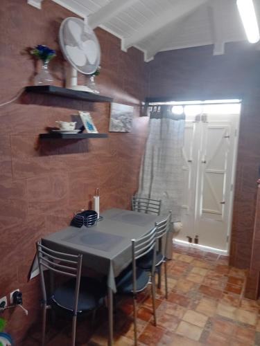 a dining room with a table and some chairs at T 1 +1 Ref 004 in Tavira