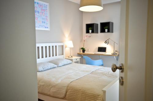 
Łóżko lub łóżka w pokoju w obiekcie Unique Apartment Aquarius II
