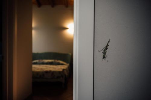 a door leading to a bedroom with a bed in a room at Albergo La Meridiana in Castelnuovo del Garda