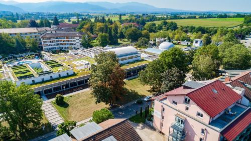 an aerial view of a town with buildings and trees at Parkhotel an der Therme in Bad Krozingen
