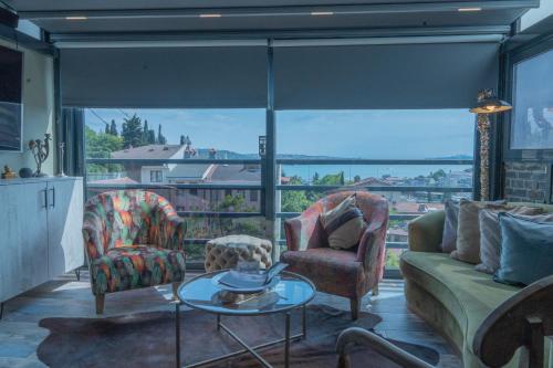 a living room with a couch and chairs and a table at WILITTON BOSPHORUS HOUSE in Istanbul