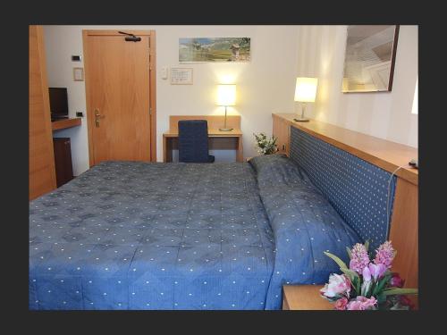Ένα ή περισσότερα κρεβάτια σε δωμάτιο στο Hotel Clarici
