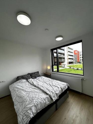 En eller flere senge i et værelse på A modern & homely apartment